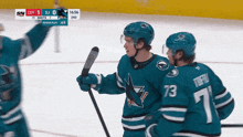 a hockey game is being played between the sharks and the cgy