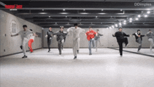 a group of young men are dancing in a dance studio with dimples written on the bottom