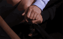a close up of a person holding another person 's leg
