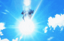 a blue sky with white clouds and the sun shining through them