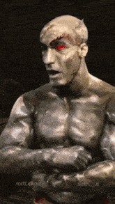 a statue of a man with red eyes and the words rolff.clips on the bottom right