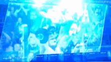 a screen shows a crowd of people and says #solive