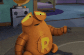 a cartoon character has a letter r on his chest