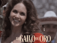 a woman in a red dress is smiling in front of a sign that says el gallo de oro