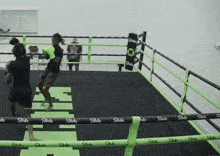 two men are boxing in a ring that says strike on it