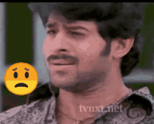 a man with a sad face next to a tvnxt.net watermark