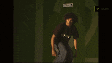 a skateboarder is doing a trick in front of a green screen that says " feeling " on it