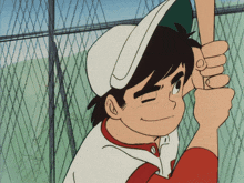 a boy in a baseball uniform is holding a bat and smiling