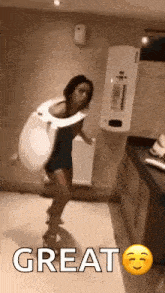 a woman is wearing a toilet seat costume and dancing .