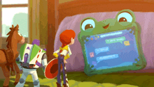 a cartoon of buzz lightyear and jessie looking at a frog shaped tablet