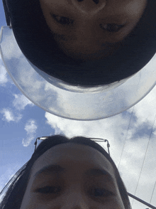 a person 's head is visible under a clear plastic visor