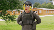 a cartoon of a woman in a military uniform standing in front of a building with the letter b on her hat