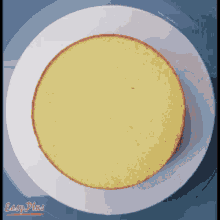a white plate with a yellow cake on it and easy place written on the bottom