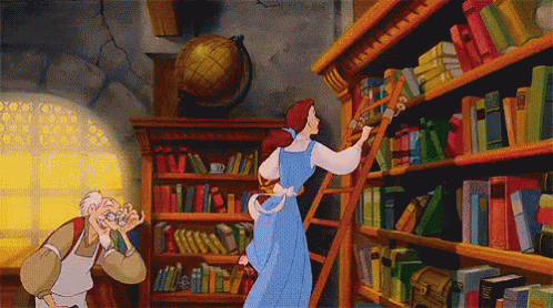 Gif of Belle from the Beauty & the Beast swinging on a ladder on a bookcase