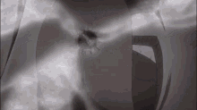 a black and white image of a person 's face with a bullet hole in it