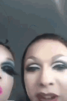 a close up of two women 's faces with makeup on .