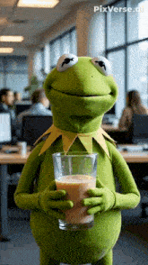 kermit the frog is holding a glass of milk