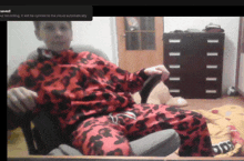 a screen shot of a person sitting in a chair with the words " saved " at the bottom