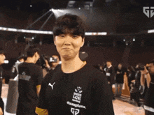 a man wearing a shirt that says lck champions on it