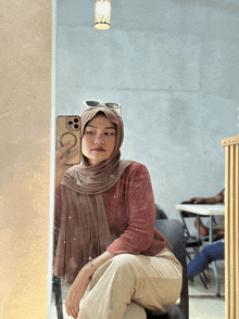 a woman is taking a selfie in front of a mirror with her phone