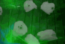 a group of white ghosts are floating in a green pool .