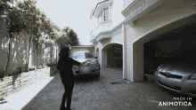 a woman stands in front of a car in a driveway that is made in animatica