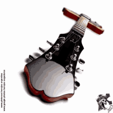 a picture of a guitar with a skull on the bottom of it