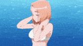 a woman in a white bra is standing in front of a blue background