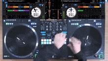 a person is playing a record on a pioneer dj machine