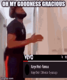 a video of a man standing in front of a door with a caption that says oh my goodness gracious