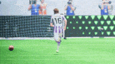 a soccer player wearing a purple and white jersey with the number 16 on it
