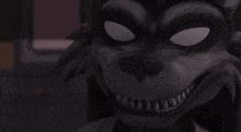 a close up of a cartoon character 's face with glowing eyes