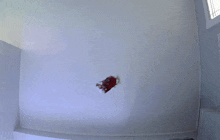 a white wall with a red circle in the middle of it
