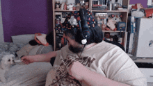 a man wearing headphones and a shirt that says " dracula "
