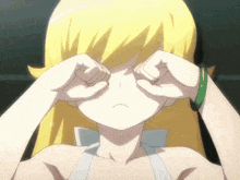 a girl with blonde hair is crying with her hands on her face