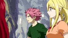 a boy with pink hair and a girl with blonde hair are standing next to each other