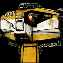 a close up of a robot with a red light on its head