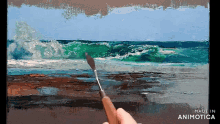 a person is painting a picture of the ocean with the words made in animotica below it