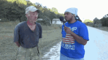 a man wearing a blue shirt that says right everything