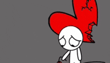 a cartoon character is standing next to a broken red heart .