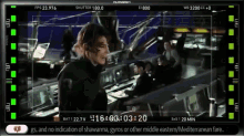 a screenshot of a film showing a man in a black jacket