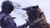 a purple robot and an orange robot are standing next to each other .