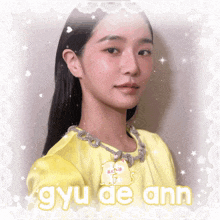 a girl in a yellow dress with the name gyu de ann on the bottom