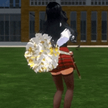 a cheerleader in a red plaid skirt is holding a large pom pom