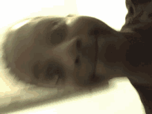 a close up of a person 's face behind a glass door