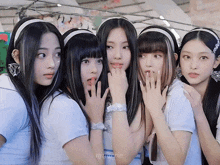 a group of young girls are posing for a picture and one of them has a bandana that says pepsi