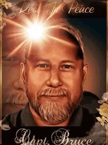 a portrait of a man with a beard and the words rest in peace above him