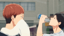 a man drinking water from a bottle that says aquafina