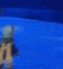 a painting of a person standing on a blue surface .