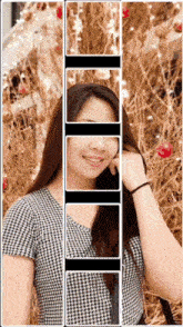 a woman in a black and white plaid shirt is smiling